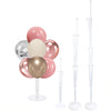 A set of pink and gold balloons displayed on an adjustable stand with a base and pole for party decorations.