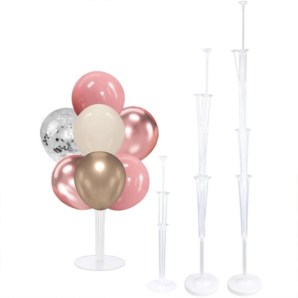 A set of pink and gold balloons displayed on an adjustable stand with a base and pole for party decorations.