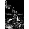 Black and white photo of a basketball player in mid-air during a game, emphasizing movement and athletic focus.