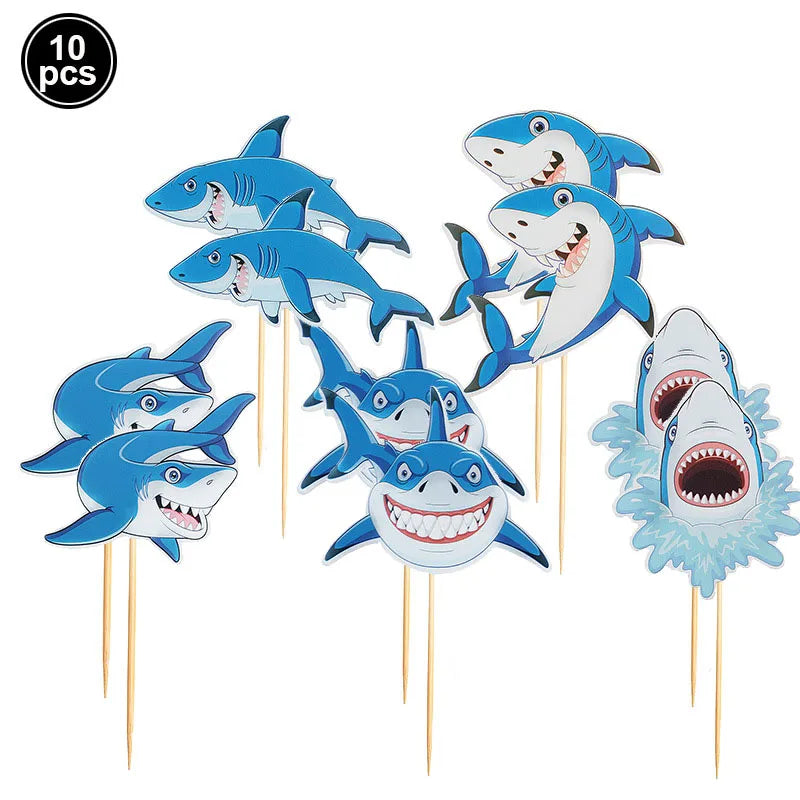 A set of ten blue shark foil balloons for an ocean-themed party decoration.