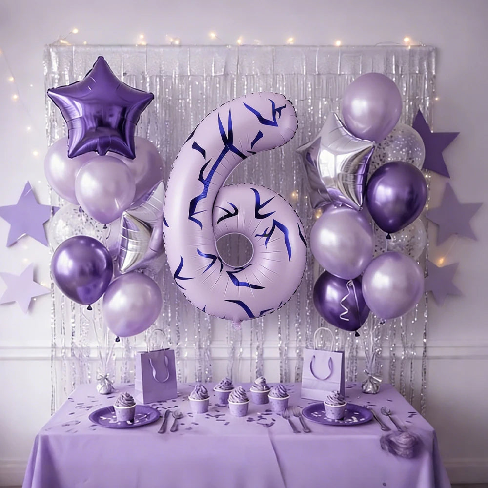 A display of purple and silver balloons shaped like the number six for a themed event