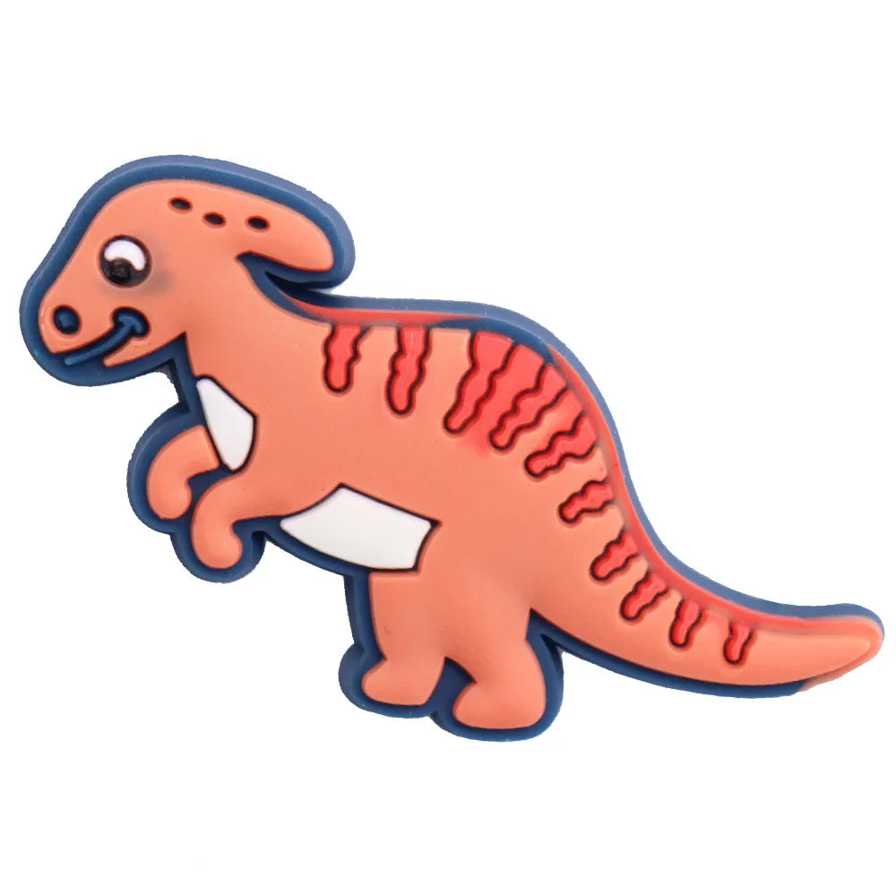 A set of twelve cartoon dinosaur PVC shoe charms in orange and blue.