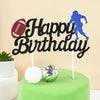 Black birthday cake toppers featuring a soccer player and football silhouette on a green cake.