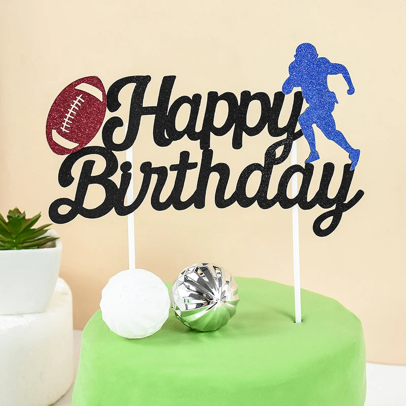 Black birthday cake toppers featuring a soccer player and football silhouette on a green cake.