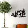 Black silhouette wall art depicting deer and forest landscape on a white wall.