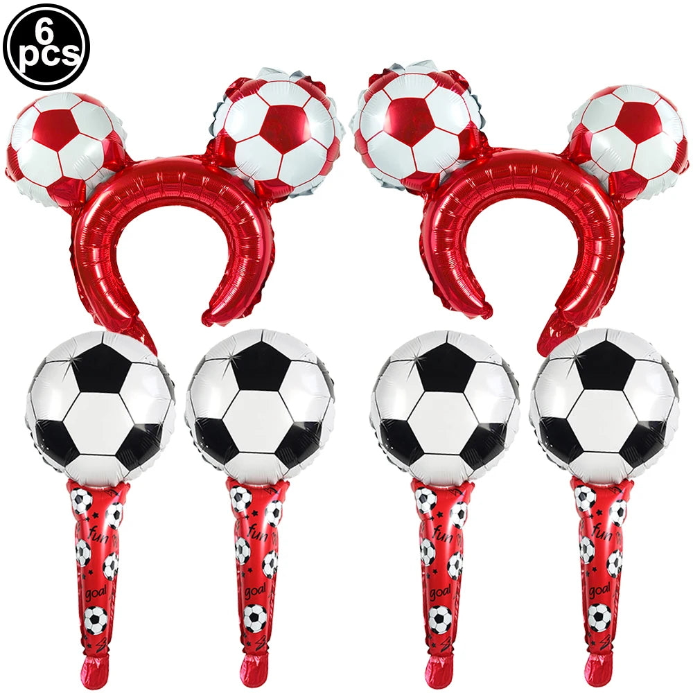 A set of six red and white standing soccer balloons or football-themed party décor items.
