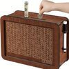 A wooden savings box with a progress tracker shows various denominations of coins inside.