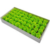 A tray filled with numerous bright green artificial rose heads for wedding and party decoration.