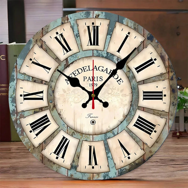 A round wooden wall clock with Roman numerals showing the time, featuring the text Paris 1979.
