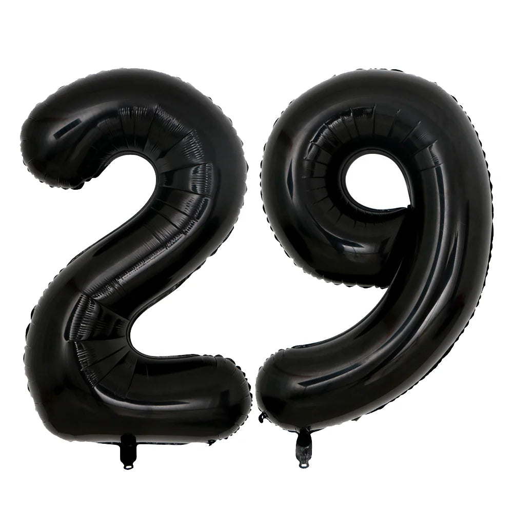 A set of two giant black foil balloons shaped like the number 29