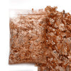 A pile of shiny gold foil flakes for resin art and jewelry making