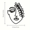 Black line drawing of a face with a laurel wreath design on a white background