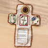 Handmade prayer quilt featuring a cross with a silver cross pocket shrine and decorative embroidery
