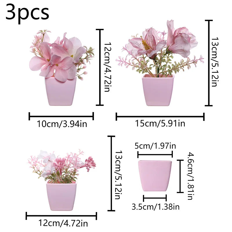 Three small pink faux bonsai plants in rectangular pots for home decor