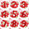 A set of red and green strawberry foil balloons shaped like the numbers 1 through 9.