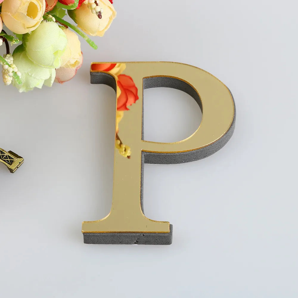 A three-dimensional golden letter P cutout against a white background with floral elements.