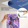 A hand is applying a roll of purple and pink vinyl wall decal onto a surface, next to packaging labeled Rise & Shine Chilucan
