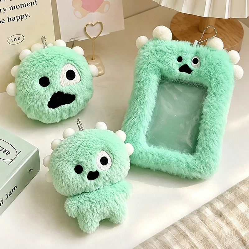 A light green fluffy plush keychain with a clear photo card holder is displayed on a white surface.