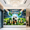 A vibrant football themed birthday backdrop banner featuring a soccer ball, trophies, and crowns on a green field.