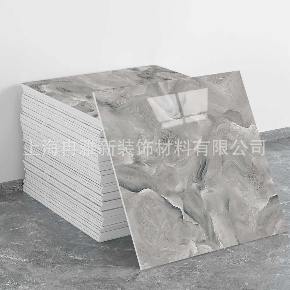 A sheet of faux marble 3D self-adhesive wall tiles showing gray and white marbled texture.