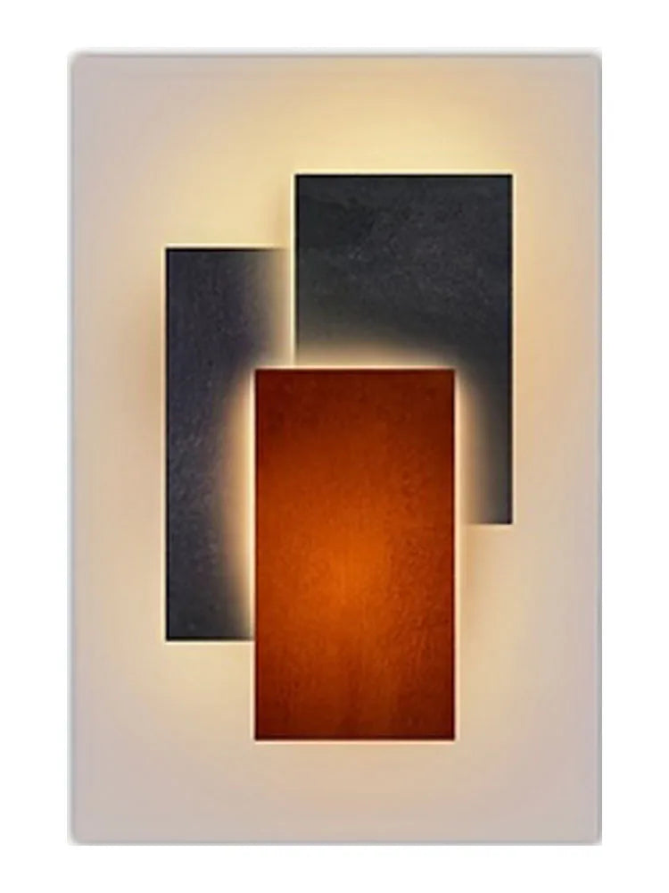 Modern geometric canvas wall art featuring three rectangular light panels in dark gray, black, and burnt orange against a whi