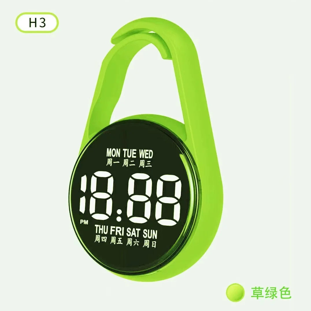 A bright lime green LED pocket watch with a black face displaying the current day of the week.