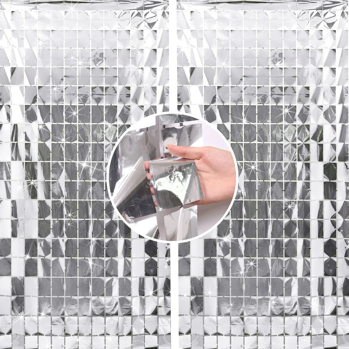 A hand is touching a silver sequin glitter party backdrop made of reflective tiles.