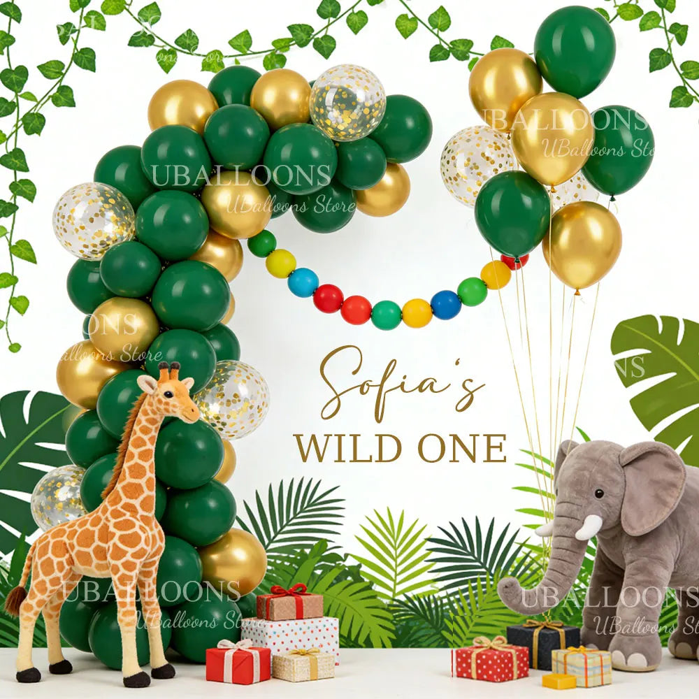 A balloon arrangement featuring a giraffe and an elephant, surrounded by chrome gold and dark green balloons.