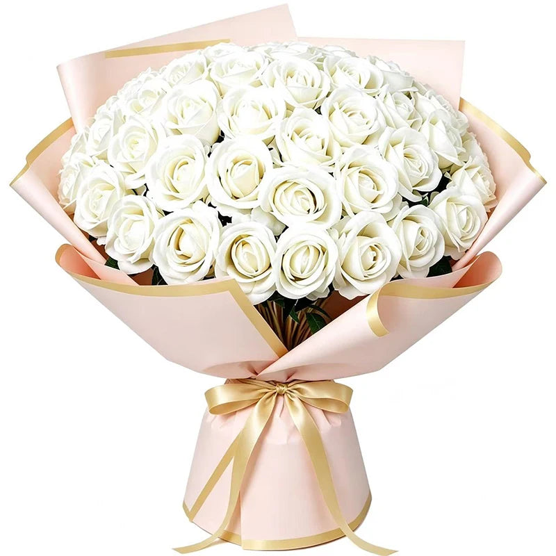A bouquet of 50 white artificial roses wrapped in pink paper and tied with a gold ribbon.