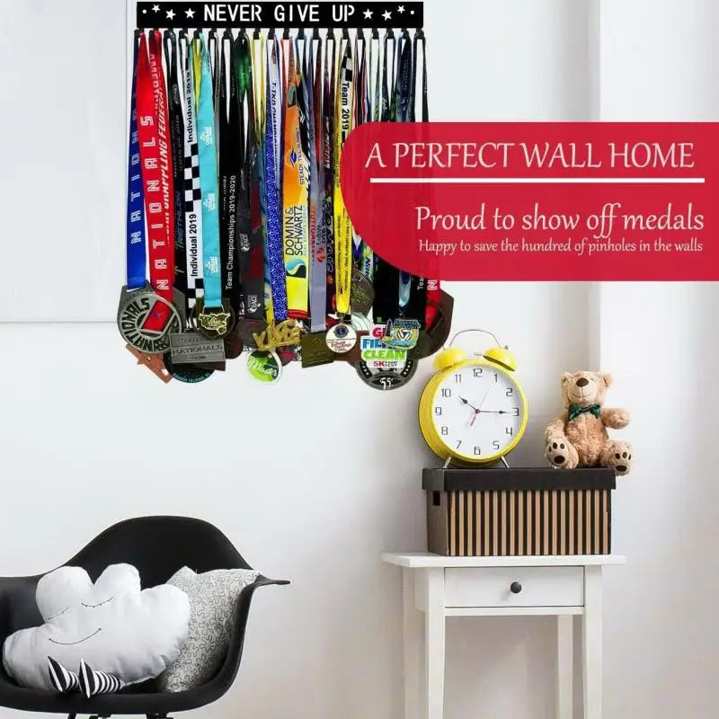 A wall-mounted metal display rack featuring various medals and a sign that reads Never Give Up