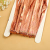 Pink metallic tinsel foil fringe curtain backdrop with glitter texture displayed on a white card.