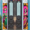 A dark wooden door decorated with a Day of the Dead banner featuring a skull and floral motifs.