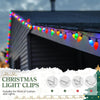 Christmas light clips strung along the edge of a roof gutter and down a siding.