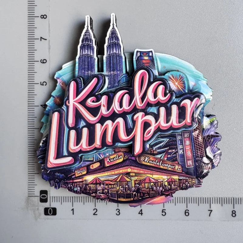 A collection of wooden destination fridge magnets featuring Kuala Lumpur landmarks and text.