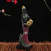 Hand-painted resin statue of an African tribal lady with gold jewelry and patterned clothing.