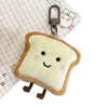 A soft, light yellow toast bread shaped plush charm attached to a metal keychain ring.