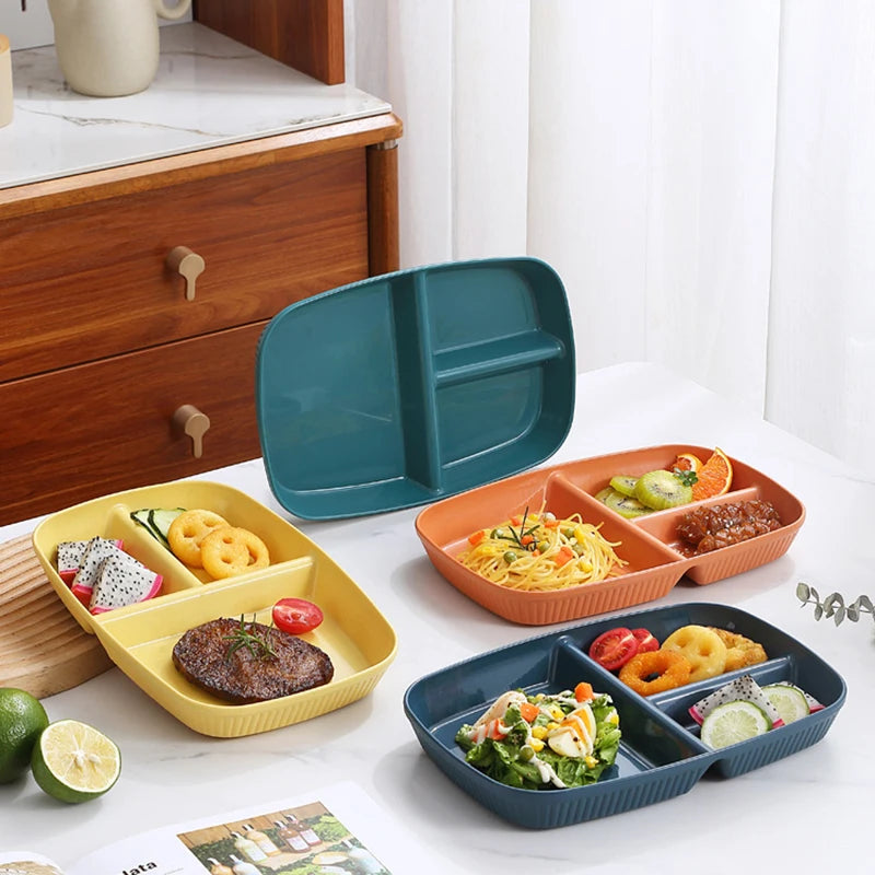 A set of three portion control plates in orange and blue for balanced meals