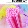 A close-up of a pack of pink heart-shaped disposable straws with a smooth cut texture.