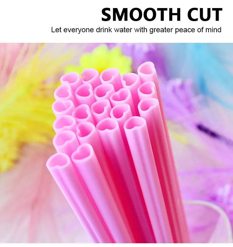 A close-up of a pack of pink heart-shaped disposable straws with a smooth cut texture.