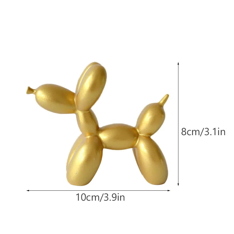 Gold resin sculpture shaped like a dog, used for modern home decor.