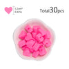 A pile of pink silicone heart beads in a small white dish, totaling 30 pieces.