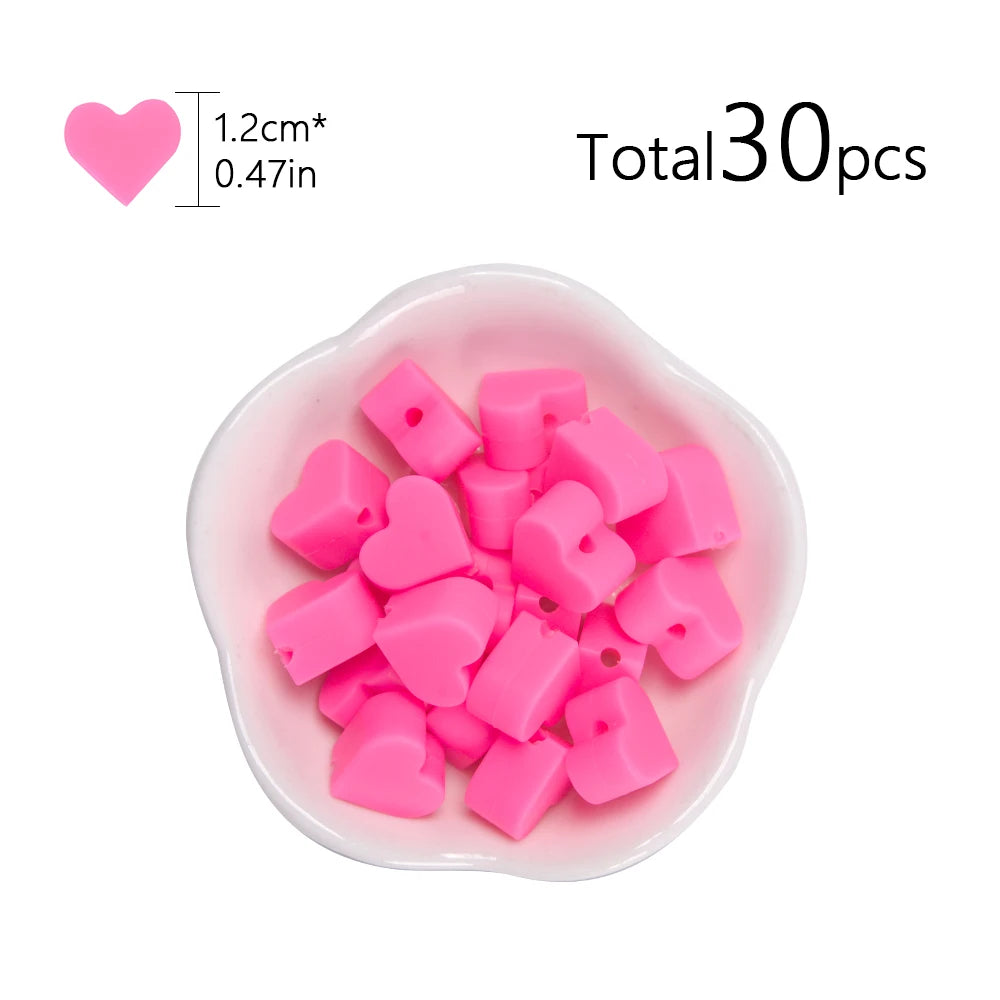 A pile of pink silicone heart beads in a small white dish, totaling 30 pieces.