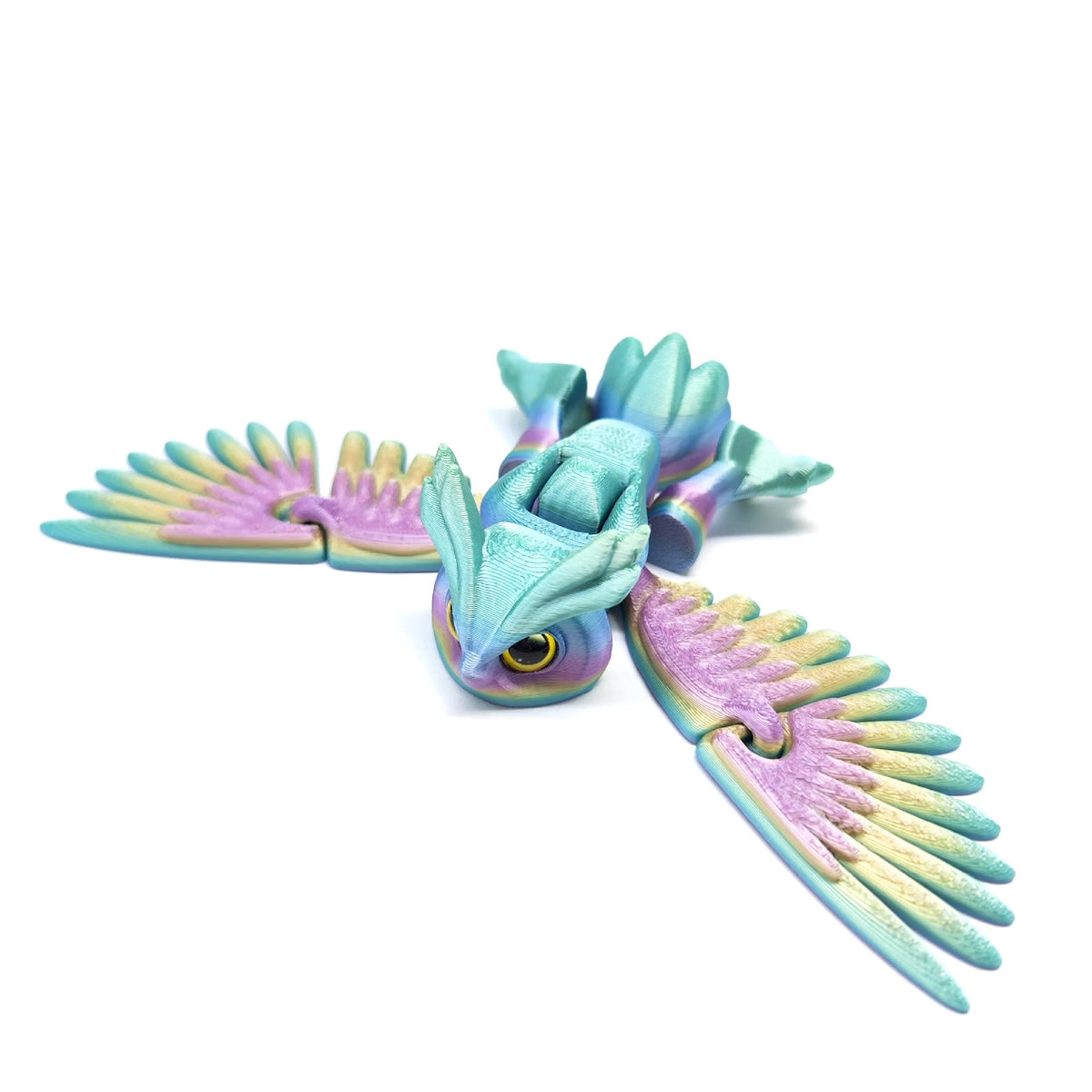 A teal and purple articulated 3D printed owl figurine with spread wings.
