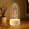 Lumière de nuit décorative rétro avec une silhouette ovale translucide de la Vierge Marie, un halo et des fleurs.