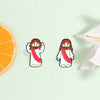Enamel lapel pin featuring a depiction of Jesus with a beard and long hair, wearing a red sash.
