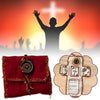 Handmade prayer quilt featuring a silver cross pocket shrine on a red fabric.