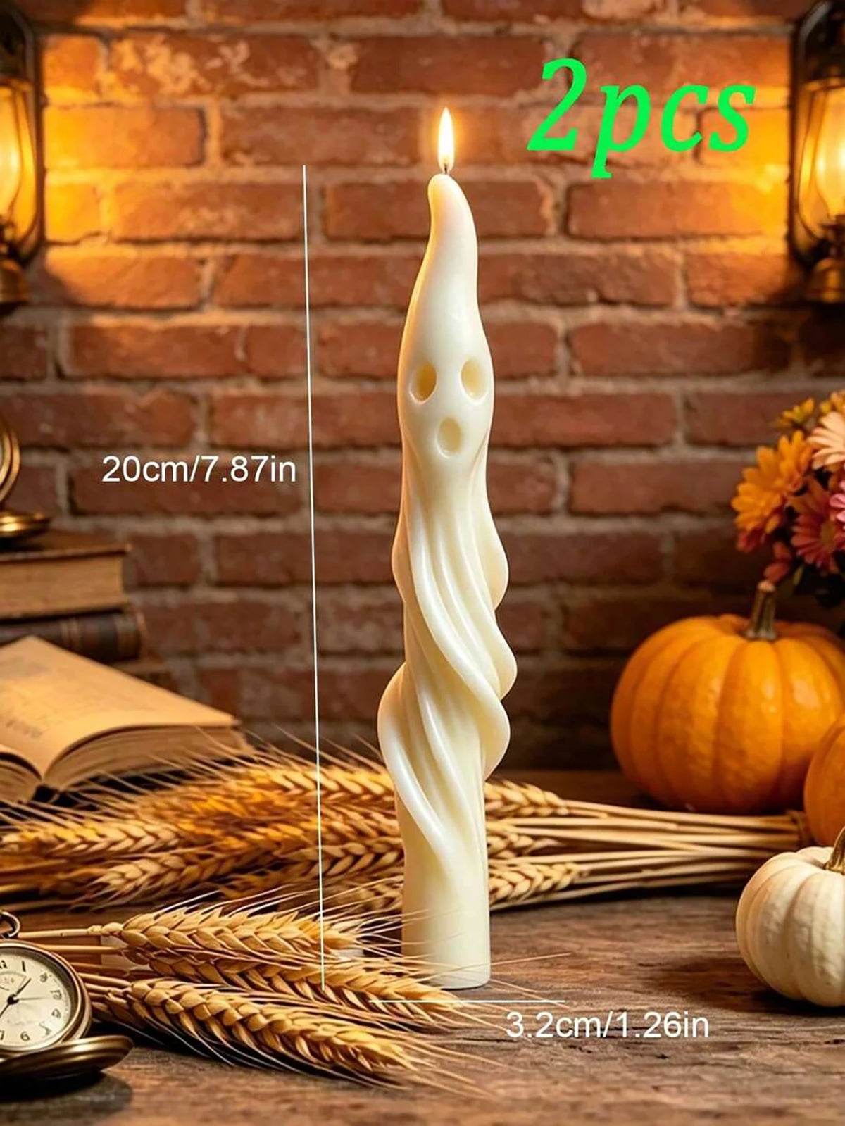 Two white soy candles shaped like a ghost and a mummy standing on straw in a rustic setting.