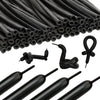 A close-up view of a large bundle of matte black latex balloons and various smaller balloon tools.