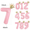 Set of pink aluminum foil crown number balloons including 1, 5, and 6, and a large 7.