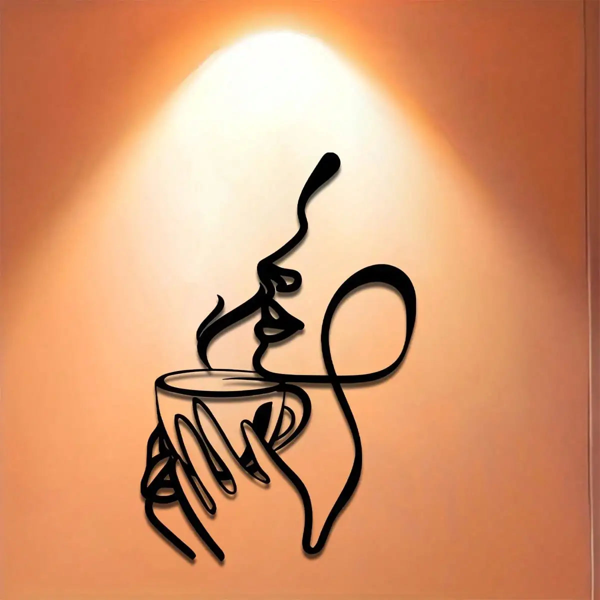 A minimalist line art metal wall sculpture depicting a hand holding a cup with steam rising from it, set against an orange ba